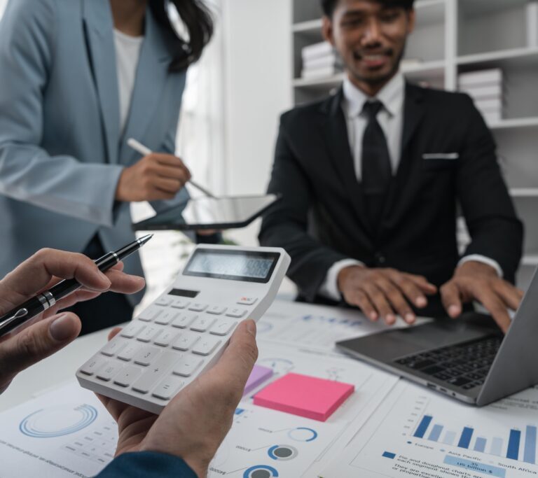 Intelligence analysis concept, group of business people brainstorm discussing current finance and economy on company investment laptop at meeting.